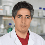 A male healthcare professional in a white lab coat, representing medical expertise and trusted health resources