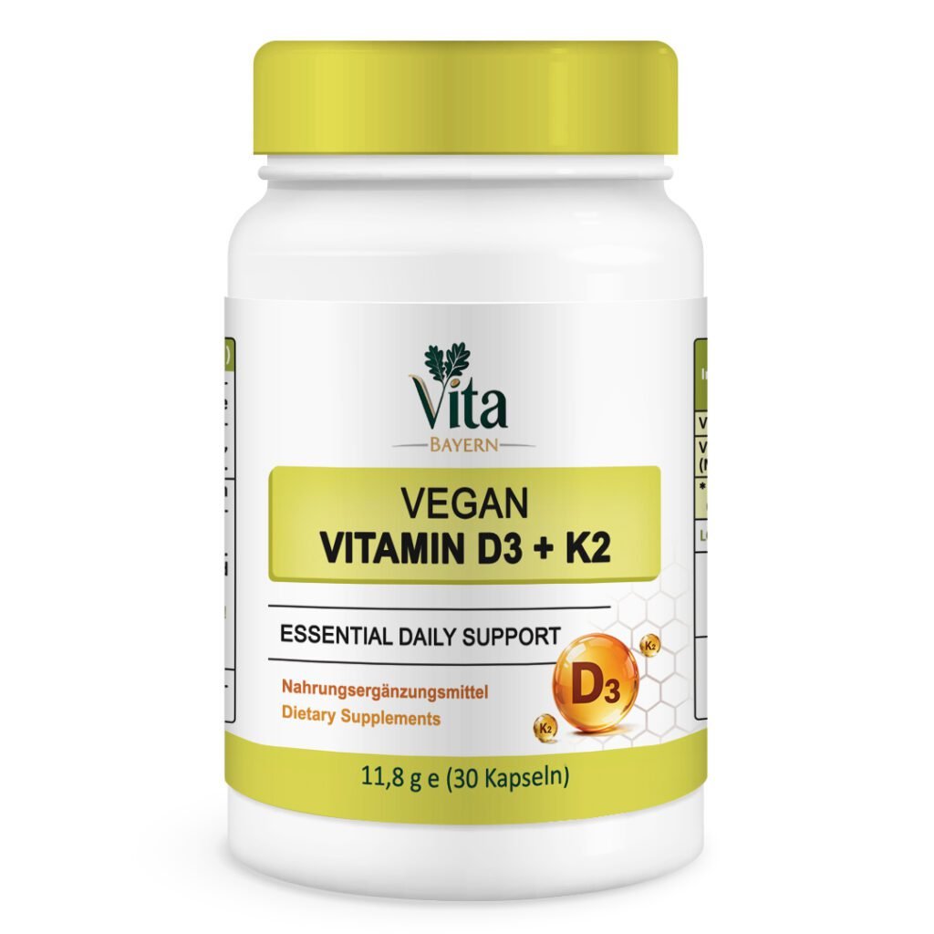 A white 30-capsule bottle of Vita Elixia Vegan Vitamin D3 + K2 "Essential Daily Support" featuring golden D3 and K2 nutrient spheres