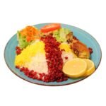 A vibrant culinary dish featuring white and yellow saffron rice topped with bright red barberries, served with roasted chicken, fresh salad, and lemon slices