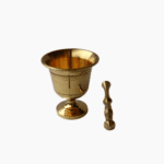 Polished gold brass mortar and pestle for grinding spices and herbs