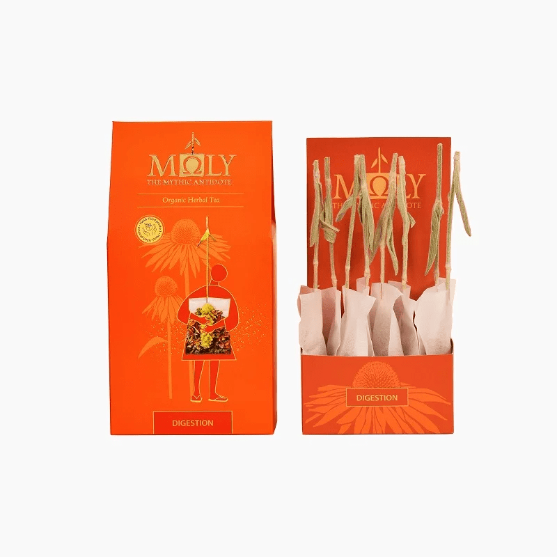 Moly Digestion organic herbal tea in bright orange packaging with an open display box of tea bags featuring herbal stems.