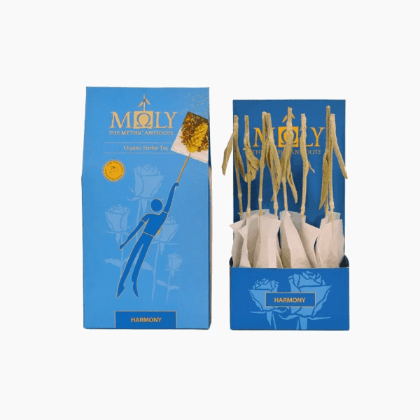 Blue retail box for Moly "Harmony" Organic Herbal Tea shown next to an open display box containing individually wrapped tea bags with natural herbal stem stirrers.
