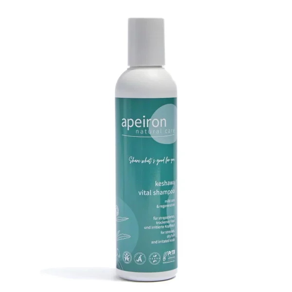 Bottle of Apeiron Keshawa Vital Shampoo for dry hair featuring a teal label and natural care branding