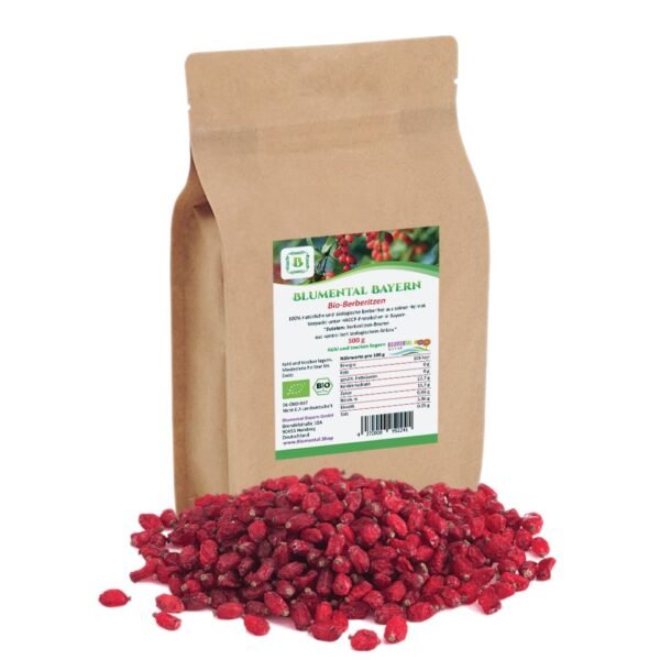A 500g brown kraft paper stand-up pouch of Blumental Bayern Bio-Berberitzen, shown behind a pile of vibrant, whole dried red barberries