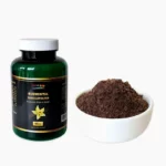 A green 50g bottle of Blumental Vanillepulver with a white cap, displayed next to a small white bowl filled with 100% pure ground vanilla powder